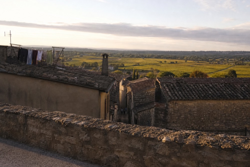 View over Saint-Emilion rooftops and vineyards from the village walls, no text, no logos, no people